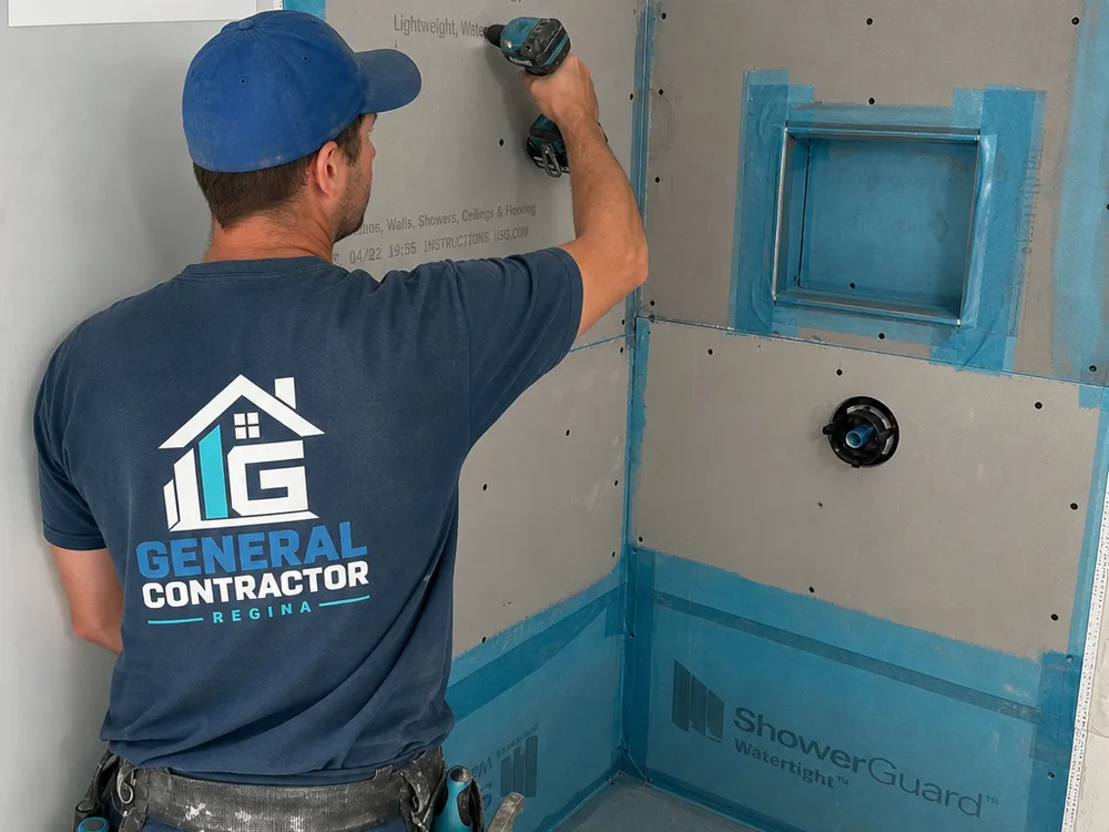 Cement board and waterproofing membrane being installed in a shower area